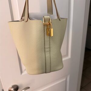 Elegant Cream Tote with Gold Lock